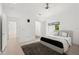 Stylish bedroom with wood floors, gray rug, and access to other rooms at 9138 Great Heron Cir, Orlando, FL 32836