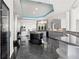 Modern kitchen featuring sleek cabinets, granite countertops, and stainless-steel appliances at 9138 Great Heron Cir, Orlando, FL 32836