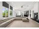Large living room showcasing floor to ceiling windows, and an expansive seating area at 9138 Great Heron Cir, Orlando, FL 32836
