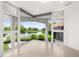 Light and bright living area with corner windows providing panoramic views of the lake at 9138 Great Heron Cir, Orlando, FL 32836