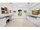Home office with great natural light, a built-in desk, and ample cabinet space at 9138 Great Heron Cir, Orlando, FL 32836