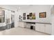 Office space with built in desk and cabinetry, along with decoratively framed paintings at 9138 Great Heron Cir, Orlando, FL 32836