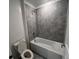 Crisp bathroom design with a tiled shower and tub combination at 930 Cattleman St, Winter Haven, FL 33881