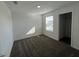 This bedroom boasts wall-to-wall carpeting and a bright window, ready for your personal touches at 930 Cattleman St, Winter Haven, FL 33881