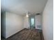 Clean, carpeted bedroom features a ceiling fan and convenient access to other rooms at 930 Cattleman St, Winter Haven, FL 33881