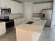 Stylish kitchen featuring stainless steel appliances and a center island at 930 Cattleman St, Winter Haven, FL 33881