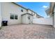 Paver patio with white fence, leading to back door entrance at 9909 Alliteration Aly, Winter Garden, FL 34787