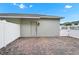 Brick-paved backyard area with white fencing and a white-colored door at 9909 Alliteration Aly, Winter Garden, FL 34787