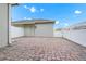 Paver patio and a white fence bordering the backyard at 9909 Alliteration Aly, Winter Garden, FL 34787