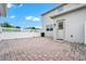 Brick-paved backyard and fenced yard, with a white door at 9909 Alliteration Aly, Winter Garden, FL 34787