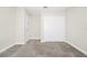 Bedroom with carpet, white walls and closet doors with double door at 9909 Alliteration Aly, Winter Garden, FL 34787