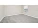 Bedroom with carpet, white walls and a window that allows natural light at 9909 Alliteration Aly, Winter Garden, FL 34787