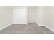 Bedroom featuring plush carpet, white walls, and closet with double doors at 9909 Alliteration Aly, Winter Garden, FL 34787