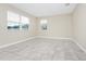 Neutral bedroom showcasing two windows and tiled flooring at 9909 Alliteration Aly, Winter Garden, FL 34787