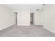 Spacious bedroom with neutral carpet, ample natural light, and closet access at 9909 Alliteration Aly, Winter Garden, FL 34787