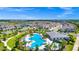 Relax and enjoy the sunny, community pool with sun loungers and seating area at 9909 Alliteration Aly, Winter Garden, FL 34787