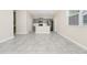 Open-concept living space featuring an eat-in kitchen with gray cabinets and stainless steel appliances at 9909 Alliteration Aly, Winter Garden, FL 34787