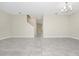 Expansive living room with tile flooring, stairway, and neutral walls at 9909 Alliteration Aly, Winter Garden, FL 34787