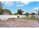 Enjoy the spacious backyard with a wooden deck, white fence, and plenty of room for outdoor relaxation at 1167 Lake Blanche Dr, Orlando, FL 32808