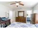 Bedroom featuring neutral colors, dresser, and attached bathroom at 1167 Lake Blanche Dr, Orlando, FL 32808