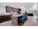 Modern kitchen featuring granite counters, stainless steel appliances, and breakfast bar seating at 1167 Lake Blanche Dr, Orlando, FL 32808