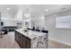 View of open concept kitchen and living space with breakfast bar seating and recessed lighting at 1167 Lake Blanche Dr, Orlando, FL 32808