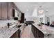 Modern kitchen with island and breakfast bar seating open to the living room at 1167 Lake Blanche Dr, Orlando, FL 32808