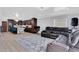 Bright, open living area connected to kitchen, featuring tile flooring and modern gray color scheme at 1167 Lake Blanche Dr, Orlando, FL 32808