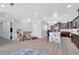Open living area featuring gray walls, tile floors, adjacent to kitchen with granite countertop island at 1167 Lake Blanche Dr, Orlando, FL 32808