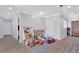 Playroom with gray walls and flooring, full of toys, and a small gray rug at 1167 Lake Blanche Dr, Orlando, FL 32808