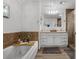 Spa-like bathroom with tub, vanity, and walk-in shower, designed for relaxation and comfort at 1328 Vassar St, Orlando, FL 32804