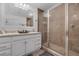 Bathroom featuring double vanity, walk-in shower, and neutral tones for a clean and modern look at 1328 Vassar St, Orlando, FL 32804