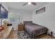 Cozy bedroom with hardwood floors, a modern dresser, and a well-lit window, creating a serene retreat at 1328 Vassar St, Orlando, FL 32804