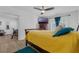 Cozy bedroom featuring a ceiling fan, TV, comfortable bed, and view into an adjacent office space at 1328 Vassar St, Orlando, FL 32804