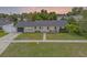 Charming single story home boasting a well-manicured lawn, lovely landscaping, and a freshly painted exterior at 1328 Vassar St, Orlando, FL 32804