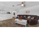 Comfortable living room with hardwood floors, a ceiling fan, and a neutral color palette, perfect for relaxation at 1328 Vassar St, Orlando, FL 32804