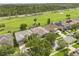 Aerial view of several homes overlooking a lush golf course at 14016 Fox Glove St, Winter Garden, FL 34787