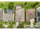 Aerial view of a home with a pool, screened in patio, and well-manicured lawn at 14016 Fox Glove St, Winter Garden, FL 34787