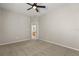 Neutral bedroom featuring carpeted floors, ceiling fan, and an adjacent bathroom at 14016 Fox Glove St, Winter Garden, FL 34787