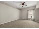 Neutral bedroom with neutral carpet, neutral walls, ceiling fan, and one window at 14016 Fox Glove St, Winter Garden, FL 34787