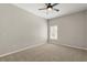 Neutral bedroom featuring carpeted floors, a ceiling fan, and a window at 14016 Fox Glove St, Winter Garden, FL 34787