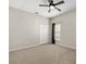 Neutral bedroom featuring carpeted floors, ceiling fan, a window and a closet at 14016 Fox Glove St, Winter Garden, FL 34787