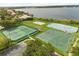 Overhead view of community tennis courts and basketball court with parking at 14016 Fox Glove St, Winter Garden, FL 34787