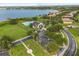 Aerial view of community amenities including pool, clubhouse, parking and lake at 14016 Fox Glove St, Winter Garden, FL 34787
