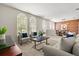 Cozy living room featuring ample natural light and seamless flow to dining area at 14016 Fox Glove St, Winter Garden, FL 34787