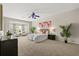 Spacious primary bedroom featuring bay windows, neutral decor, and plenty of natural light at 14016 Fox Glove St, Winter Garden, FL 34787