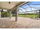 Spacious covered patio featuring brick flooring, pillars, and a golf course view at 14016 Fox Glove St, Winter Garden, FL 34787