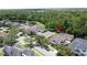 Lovely aerial view of a home in a beautiful community with mature trees and a nearby pond at 14044 Chicora Crossing Blvd, Orlando, FL 32828