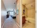 Hallway view of full bathroom with shower and bedroom with ceiling fan at 14044 Chicora Crossing Blvd, Orlando, FL 32828