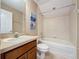 Full bathroom features a vanity with wood cabinets and a tiled shower/tub at 14044 Chicora Crossing Blvd, Orlando, FL 32828